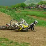 A dirt bike falls with a rider falls
