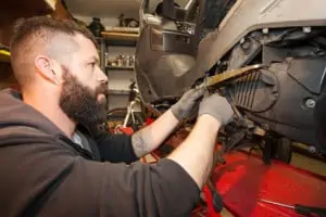 biker doing custom work in garage