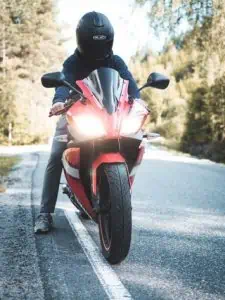 A Rider On Bike Standing On the Road