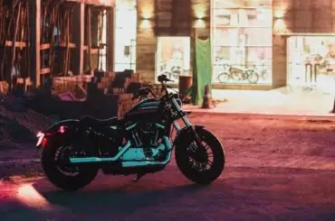 Ins and Outs of Underinsured and Uninsured Motorcycle Insurance bike parked infront of a store