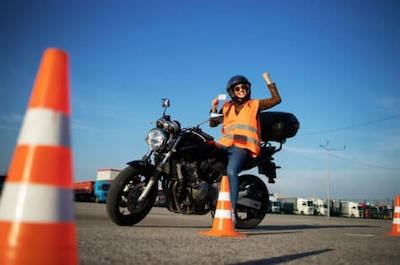 a biker celebrates after obtaining driving license