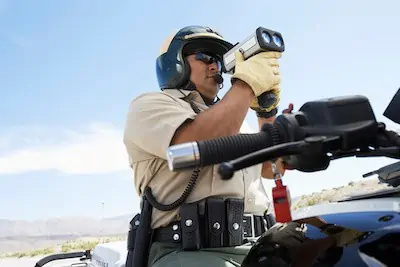 officer with a radar gun