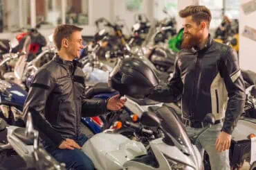 men exchanging bike key