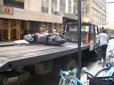 A scooter towed from street