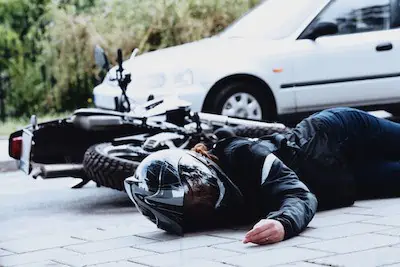 biker crushed with a car
