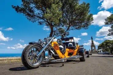Want to Turn Your Bike into a Trike? Here’s How to Cut the Costs and Update Your Insurance! trike showcased on road in Spain