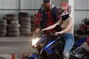 teacher instructing a girl on bike