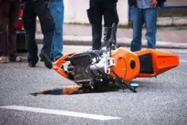 FR44 Insurance: When Do You Need it for Motorcycle? a bike dropped on road