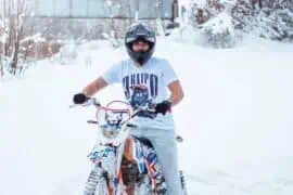 How to Winterize Your Motorcycle Correctly? Rider riding a bike in winter