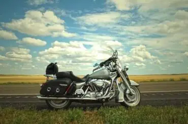 Guide for Long-Distance Motorcycle Riding: Tips for the Best Preparation! long road trip under blue sky