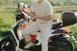 man goes outdoor with a moped