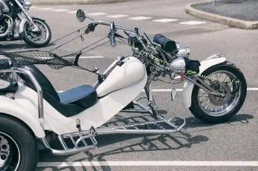 How do Various Factors Impact the Cost of Insuring a Polaris Slingshot? while trike on the road