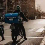 rider with bike to deliver dominos pizza