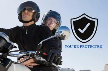 Understanding How Motorcycle Insurance Protects Your Modified Bike couple riding a bike with her wife behind
