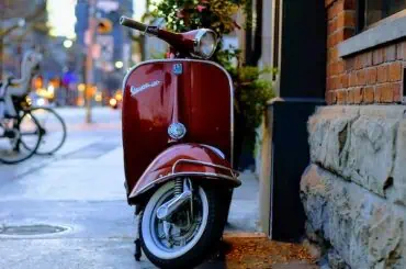 How to Choose the Perfect Scooter or Moped: A Comprehensive Buying Guide scooter parked outside home