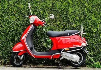 red vespa is parked