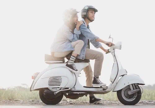 couple fun riding a scooter