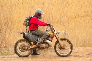 Custom Dirt Bike Insurance for Active Riders with Extensive Mods dirt bike with rider in red dress