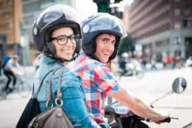 Recommended Items to Wear When Riding a Motorcycle as a Passenger Happy motorcyclist with pillion having fun